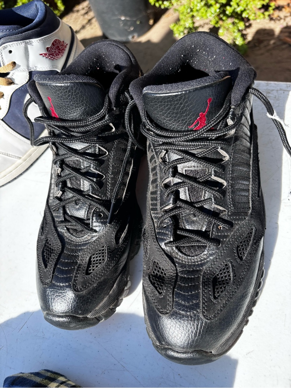 Jordan Men’s Black Basketball Sneakers with Red Jumpman Accent